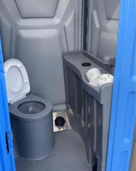 Deluxe porta potty interior with sink