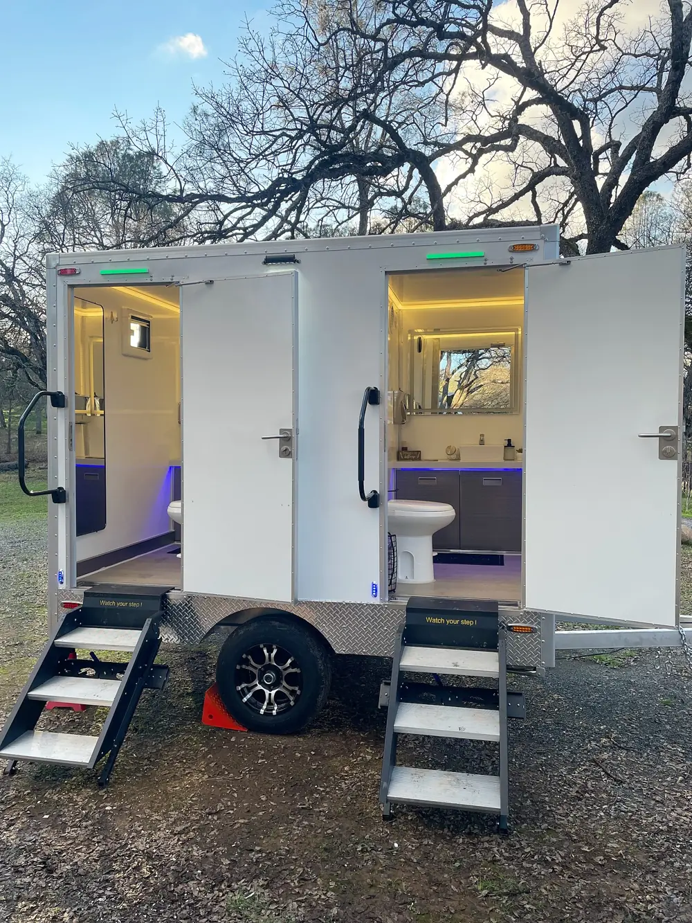 Two-stall luxury restroom trailer with lit steps